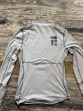 The North Face Light Blue Long Sleeve Performance Top with Contrast Stitching